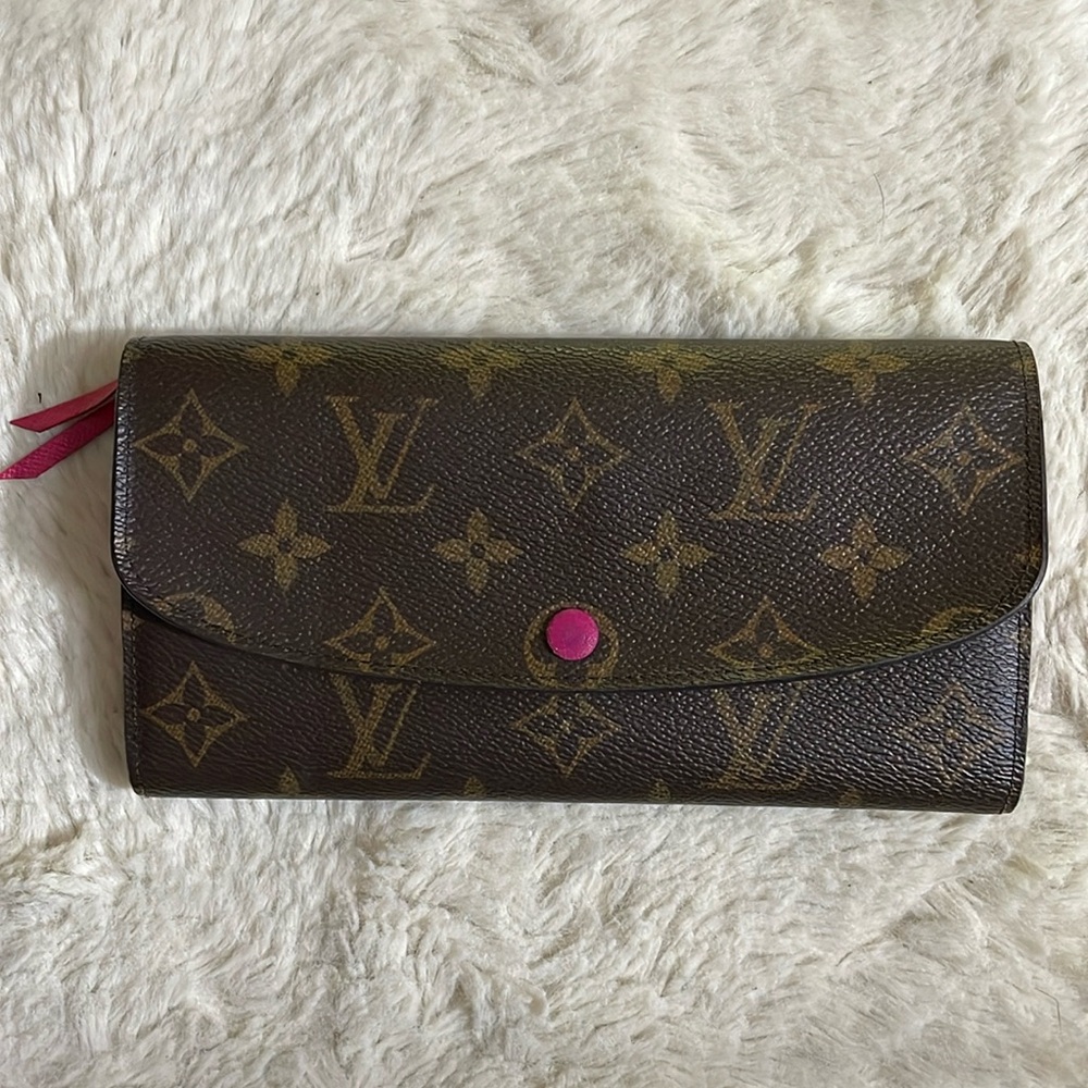 Authentic Louis Vuitton monogram wallet preowned with pink interior